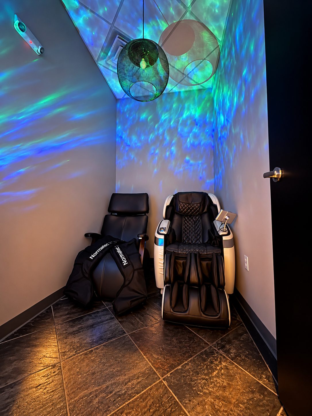 Therapeutic room with massage chair and Normatec compression